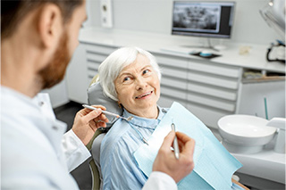 Older couple enjoying benefits of dental implants in Fort Worth