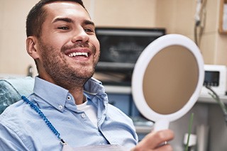 Man smiling at the dentist