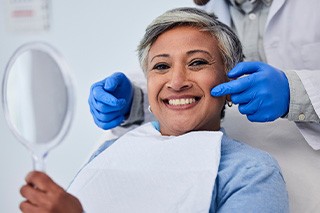 A woman pleased with her cosmetic dental results