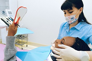 Woman in dentist’s chair for a dental checkup