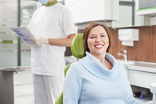 Woman in dentist’s chair after a checkup